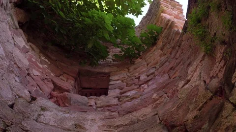 Looking up from bottom of castle wall pit 4k Stock Footage 93214922