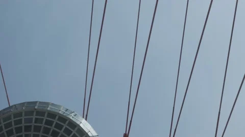 Looking up bridge modern constructions opposite blue sky. Urban industrial view Vídeo Stock 152479392