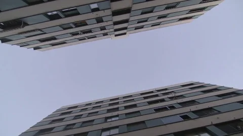 Looking up at buildings at dusk Stock Footage 83537982
