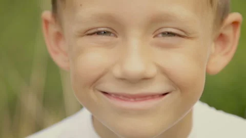 Looking into the camera boy with big eyes Stock Footage 96061558