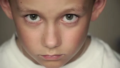 Looking into the camera boy with big eyes Stock Footage 160459334