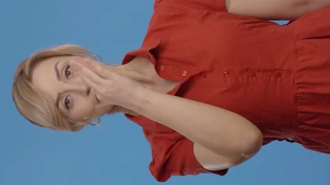 Looking at the camera, close the mouth lock and discard the key. Video stock 152027804