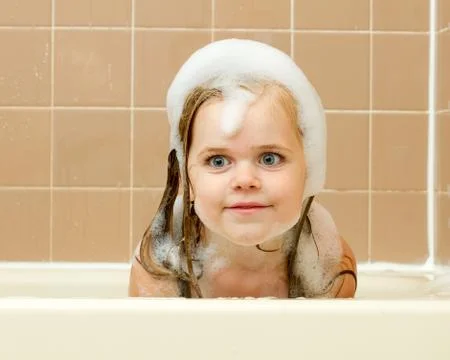 Looking at the camera covered in suds Stock Photos