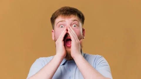 Looking at the camera with a mix of excitement and Stock Footage 234690815