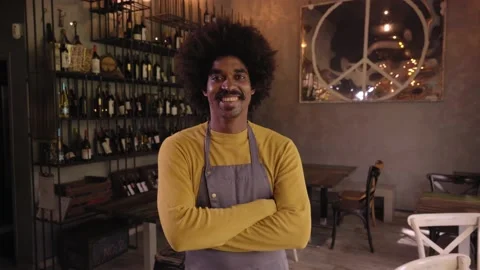 Looking at camera portrait of young owner of a small local business. African Stock Footage 229503016