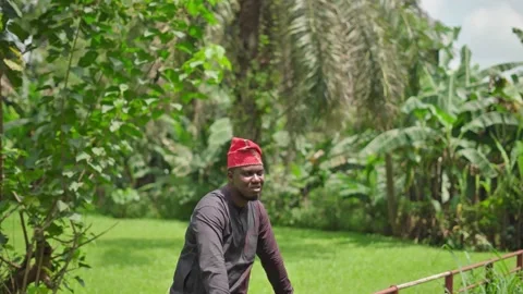 Looking at the camera smiling and looking away. 스톡 동영상 283984617