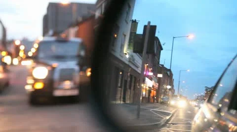 Looking into Car Mirror Whilst Driving in Evening Stock Footage 10685314