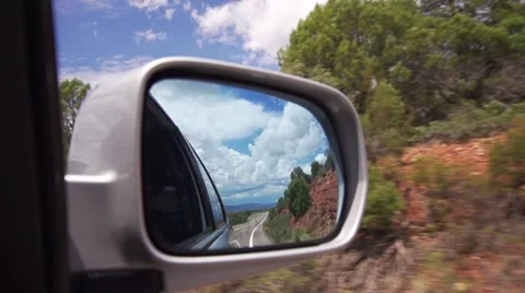 Looking into Car Side Mirror While Driving Stock Footage 51676816