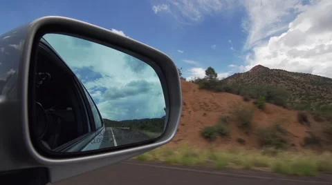 Looking into Car Side Mirror While Driving, camera in the mirror Stock Footage 51677573