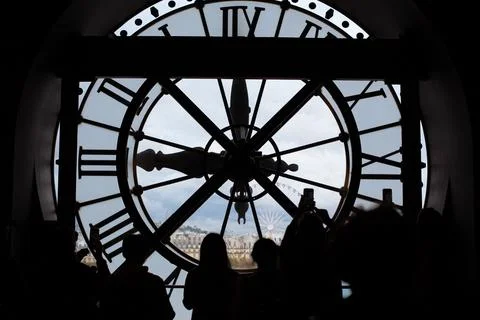 Looking at the city behind the clock Stock Photos