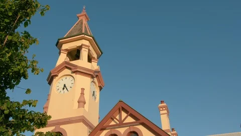 Looking up at clock tower and blue sky Stock Footage 86461227