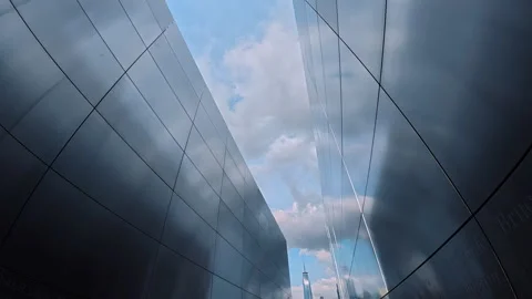 Looking at the cloudy sky among the metal walls. Inside the Empty Sky memorial Stock Footage 320066047