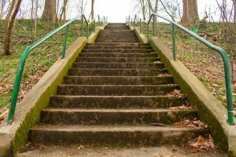 Looking Up Concrete Steps With a Green Railing in a Suburban Park in Pennsylv Stock Photos