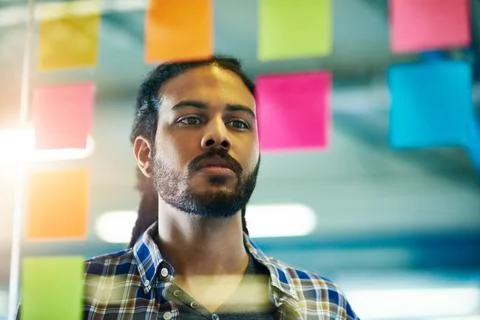 Looking at creativity logically. a young man having a brainstorming session with Foto stock
