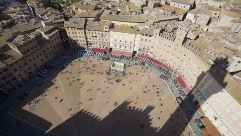 Looking at crowds in Piazza del Campo in Sienna from Palazzo Publico Stock Footage 103204280