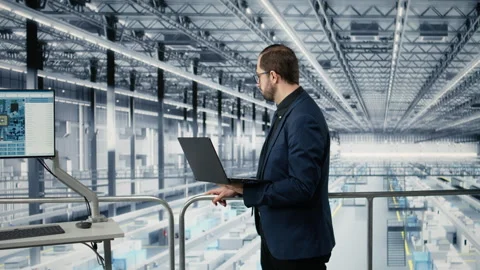 Looking at data, laptop and portrait of cheerful man improving microchips Stock Footage 333379183