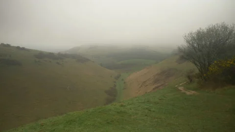 Looking into Devil's Dyke Low Cloud Misty Spring Countryside West Sussex England Stock Footage 237351852