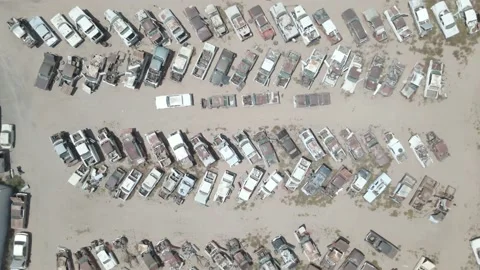 Looking directly down above a breaker's yard from a drone Stock Footage 192561380