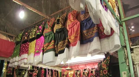 Looking Up At A Display of Handcrafted Dresses Being Sold in Mexico Video stock 19326528