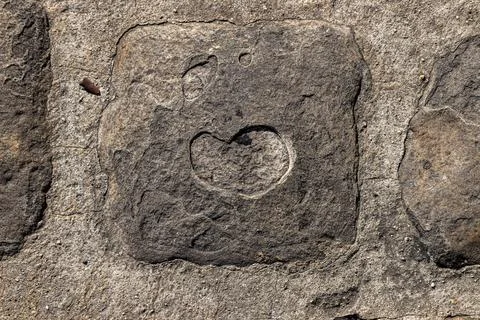Looking down at an abstract heart shape on a cobblestone in Paris Stock Photos