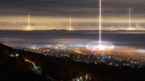 Looking down as alien laser weapons come down from clouds Stock Footage 146806089