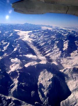 Looking down on the Alps flying from Rome to the UK Stock Photos