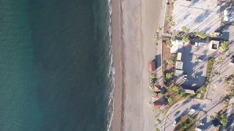 Looking down and flying along the beach Stock Footage 232987780