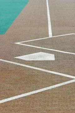Looking down a baseball field from behind home plate 스톡 사진