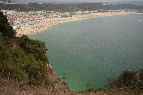 Looking down at a bay at the shore of a small town Stock Photos