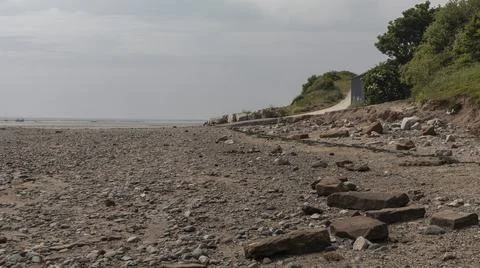 Looking down a beach at a low level Stock Photos