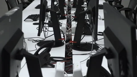 Looking Down Behind Computer Monitors And Plug Sockets On Desk During Stock Footage 145699029