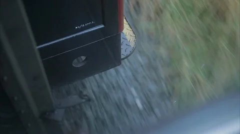 Looking down between moving steam train carriages Video stock 128417938