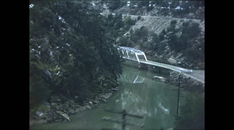 Looking Down at Bridge over Mountain River Stock Footage 47644816
