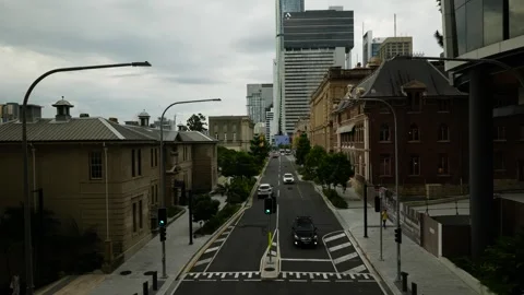 Looking down on Brisbane traffic near Queens Wharf Development 6K Stock Footage 329280629