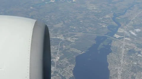 Looking down on city from jet Stock Footage 11034607