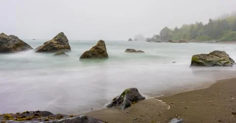 Looking Down Coastline with Smooth Waves 写真素材