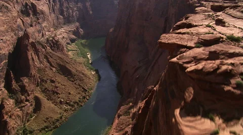 Looking down onto Colorado River flowing through deep canyon Stock Footage 59524781
