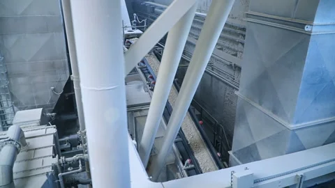 Looking down at the conveyor belt transporting white clay for future processing. Stock Footage 168694862