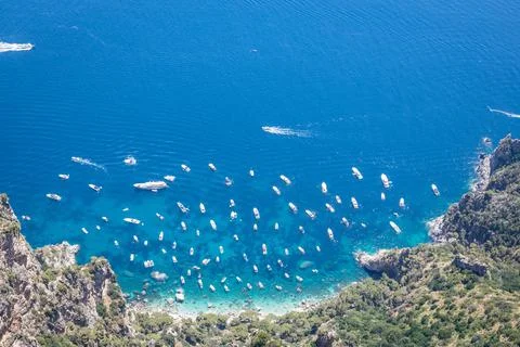 Looking down at a cove of the bright blue waters of the Mediterranean Sea wit 스톡 사진