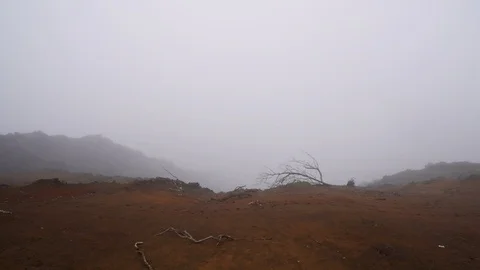 Looking Down Desolate Mountainside into Low Cloudtops Vidéo 118417115