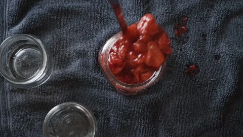 Looking down filling canning jar 스톡 동영상 241117097