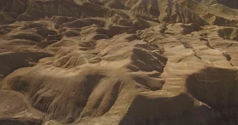 Looking down on flight over desert hills Stock Footage 81049362
