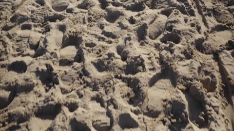 Looking down at footsteps in the sand Video stock 329669988