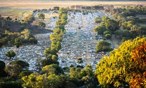 Looking down on a graveyard from a hill Stock Photos