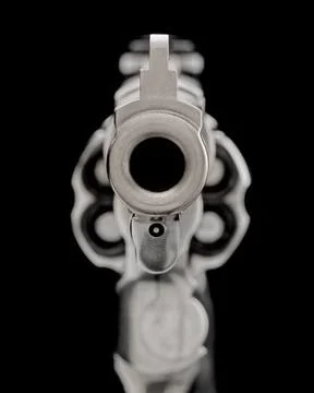 Looking down a hand gun barrel Foto stock