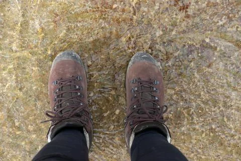 Looking down at hiking boots 写真素材