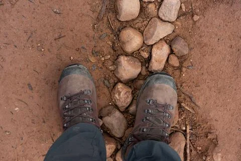 Looking down at hiking boots Stock Photos