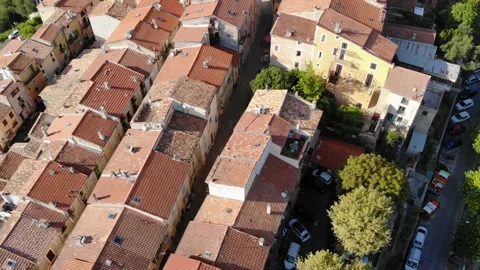 Looking down on houses with red tiled roofs of Castellar village, French Riviera Stock Footage 144833287