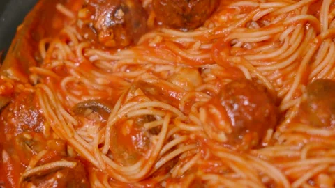Looking Down at Italian Meatballs in Pan with Spaghetti Pasta in Rich Tomato Stock Footage 300431572