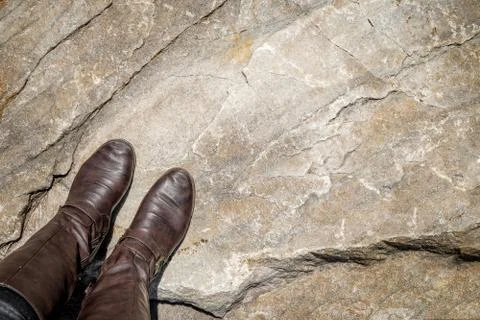 Looking down at leather boots Stock Photos